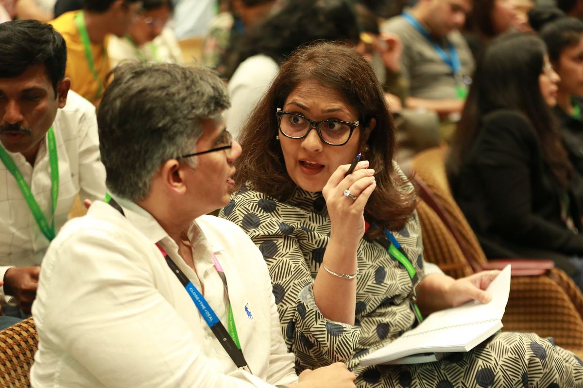 Two participants in conversation during a session