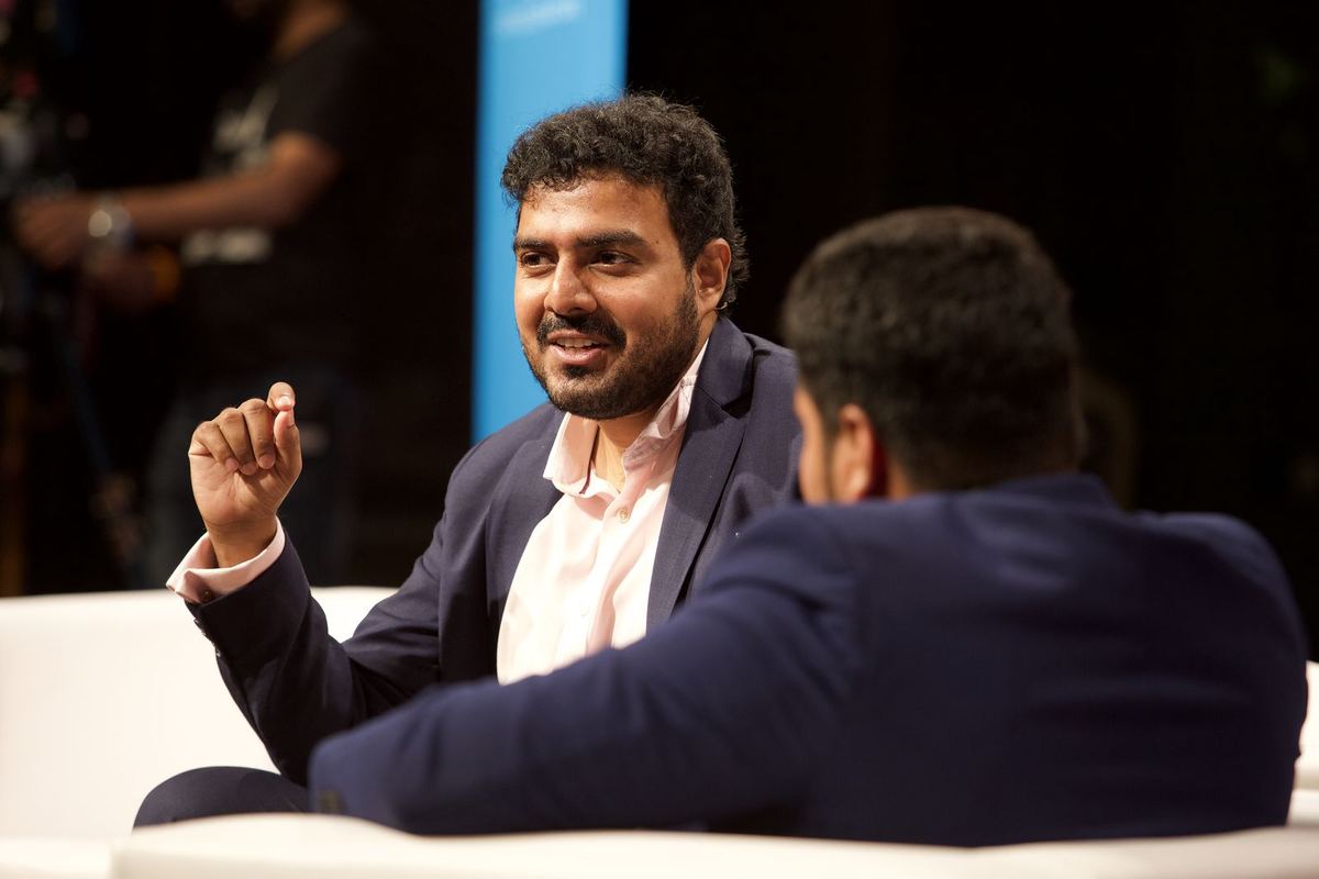 Antano in close conversation on stage
