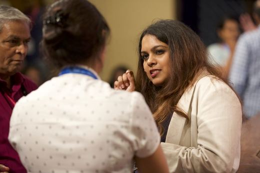 Harini in close conversation with a participant